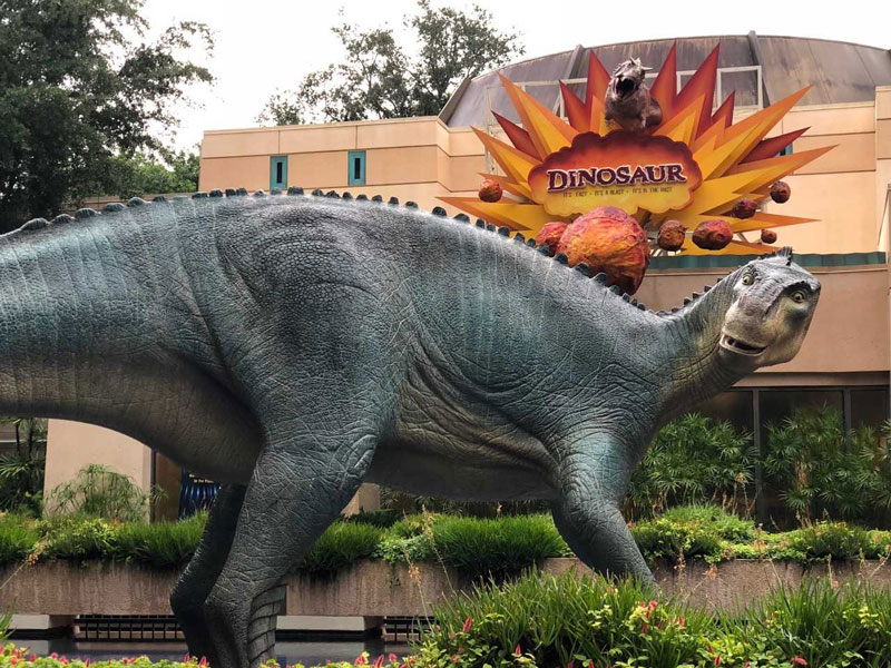 Dinosaur in front of Disney Animal Kingdom DinoLand